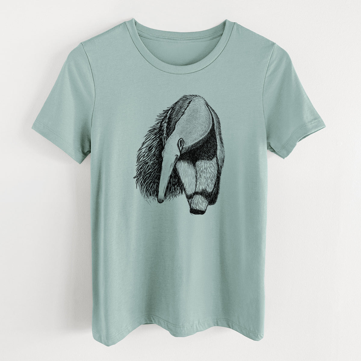 Dusty blue women's relaxed fit cotton t-shirt laid flat, printed with a detailed black ink illustration of a giant anteater with its long snout and bushy tail.