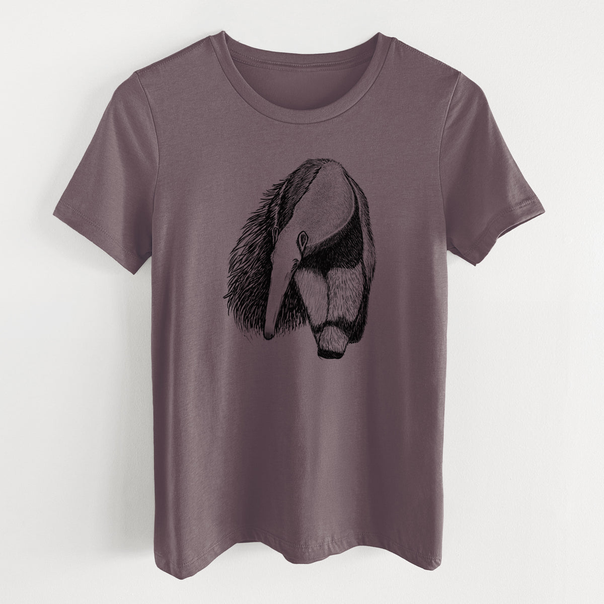 Purple storm women's relaxed fit cotton t-shirt laid flat, printed with a detailed black ink illustration of a giant anteater with its long snout and bushy tail.