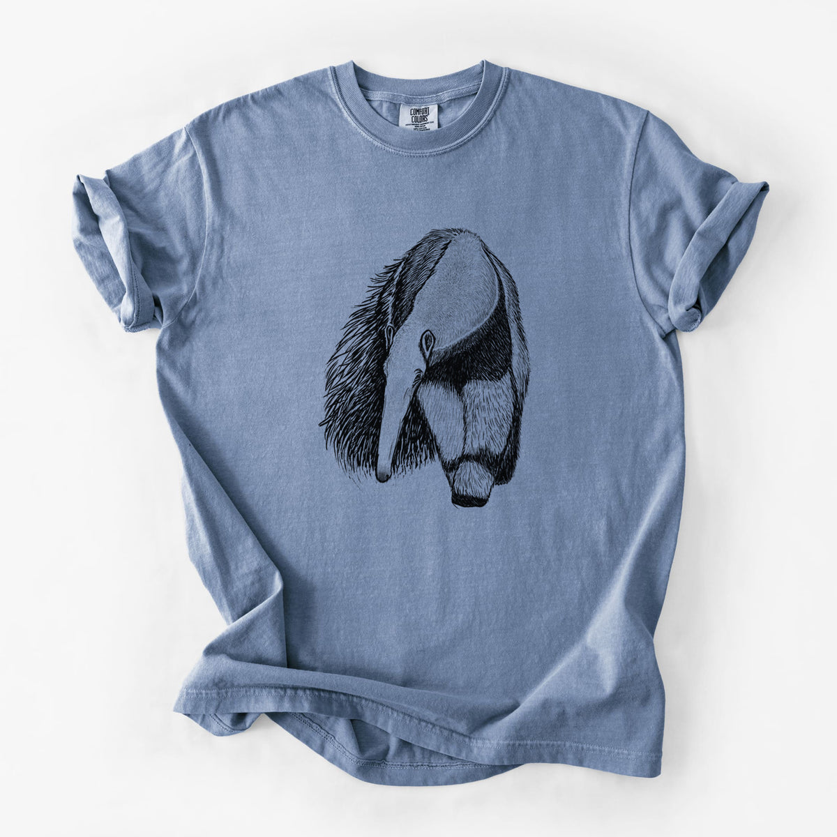 Blue jean Comfort Colors t-shirt laid flat, printed with a detailed black ink illustration of a giant anteater with its long snout and bushy tail.