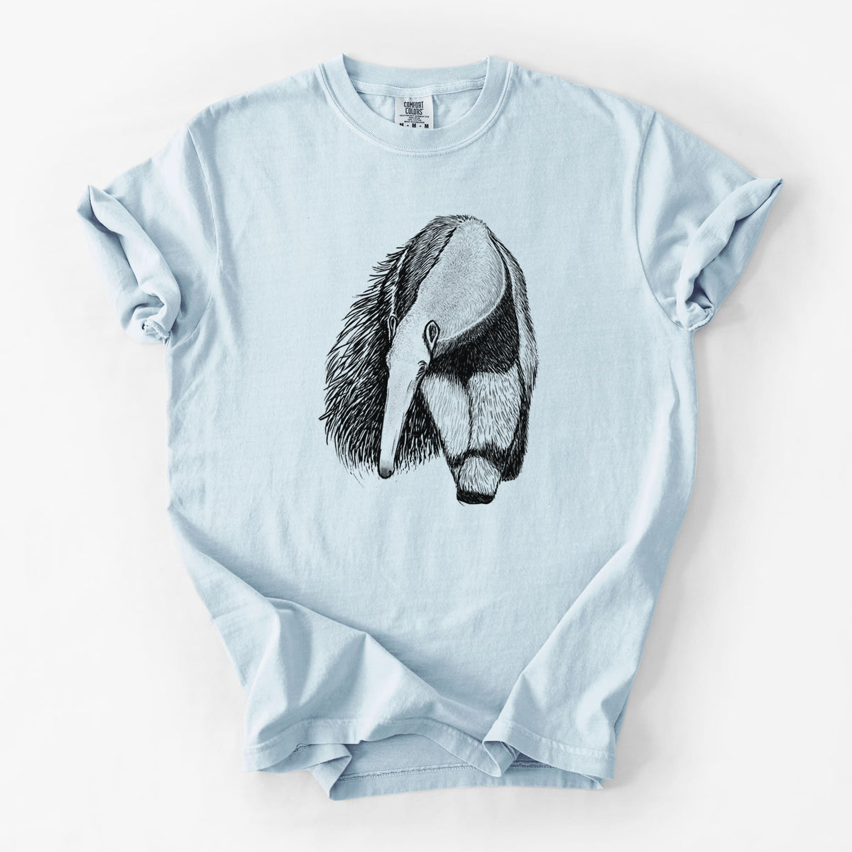 Chambray blue Comfort Colors t-shirt laid flat, printed with a detailed black ink illustration of a giant anteater with its long snout and bushy tail.