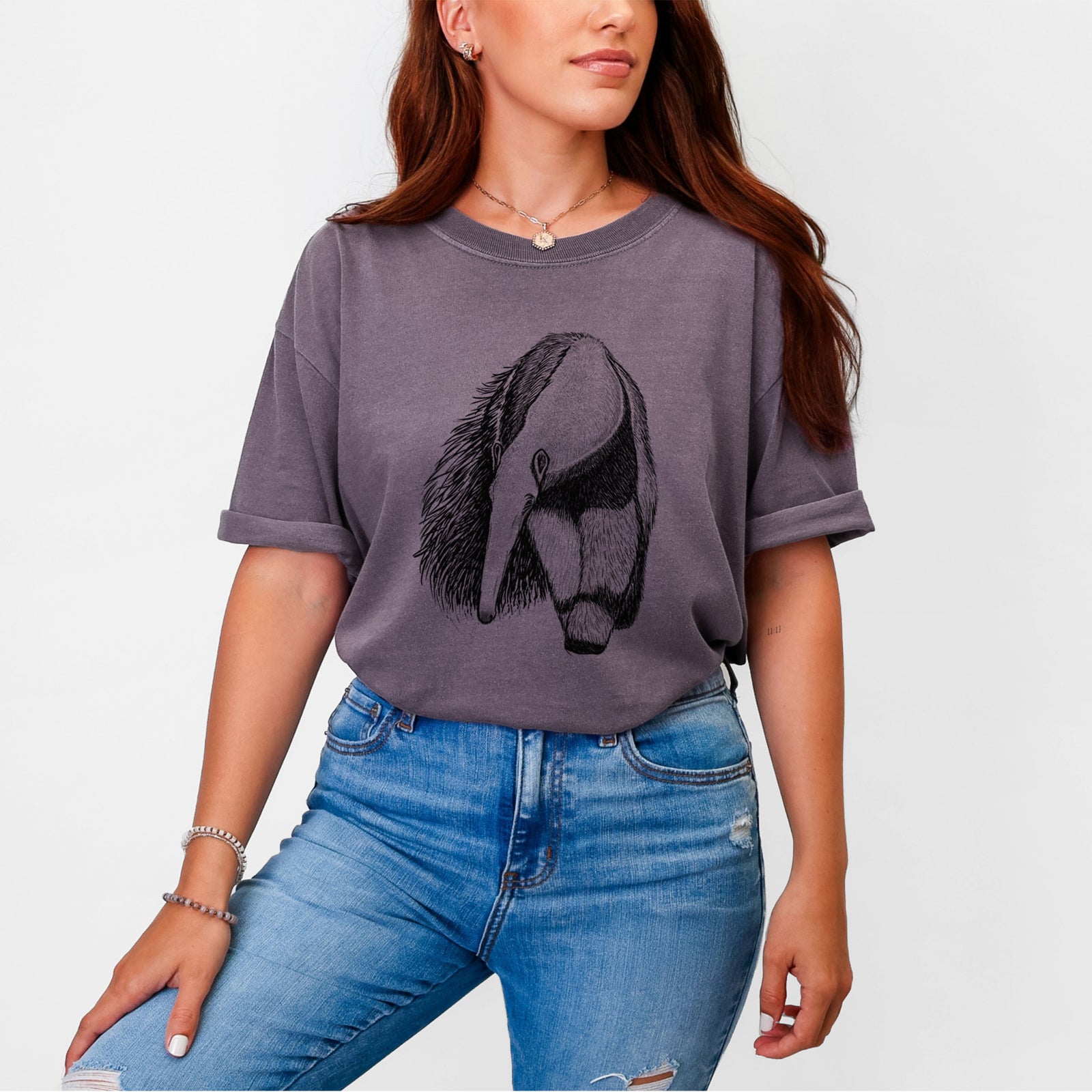 Blue jean Comfort Colors t-shirt laid flat, printed with a detailed black ink illustration of a giant anteater with its long snout and bushy tail.