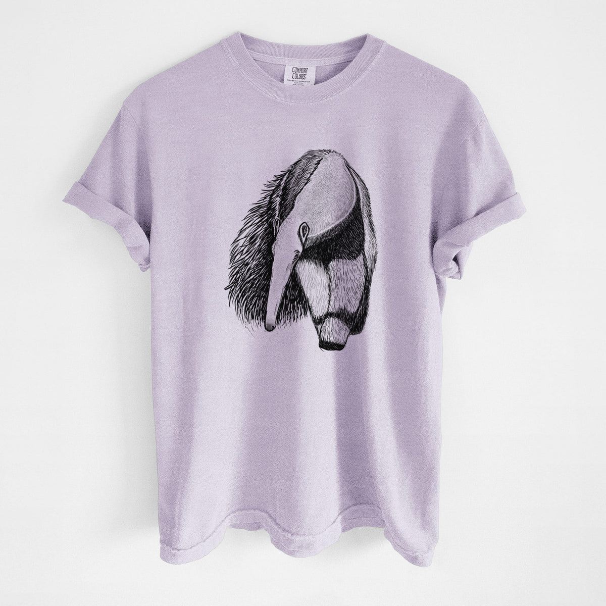 Orchid purple Comfort Colors t-shirt laid flat, printed with a detailed black ink illustration of a giant anteater with its long snout and bushy tail.