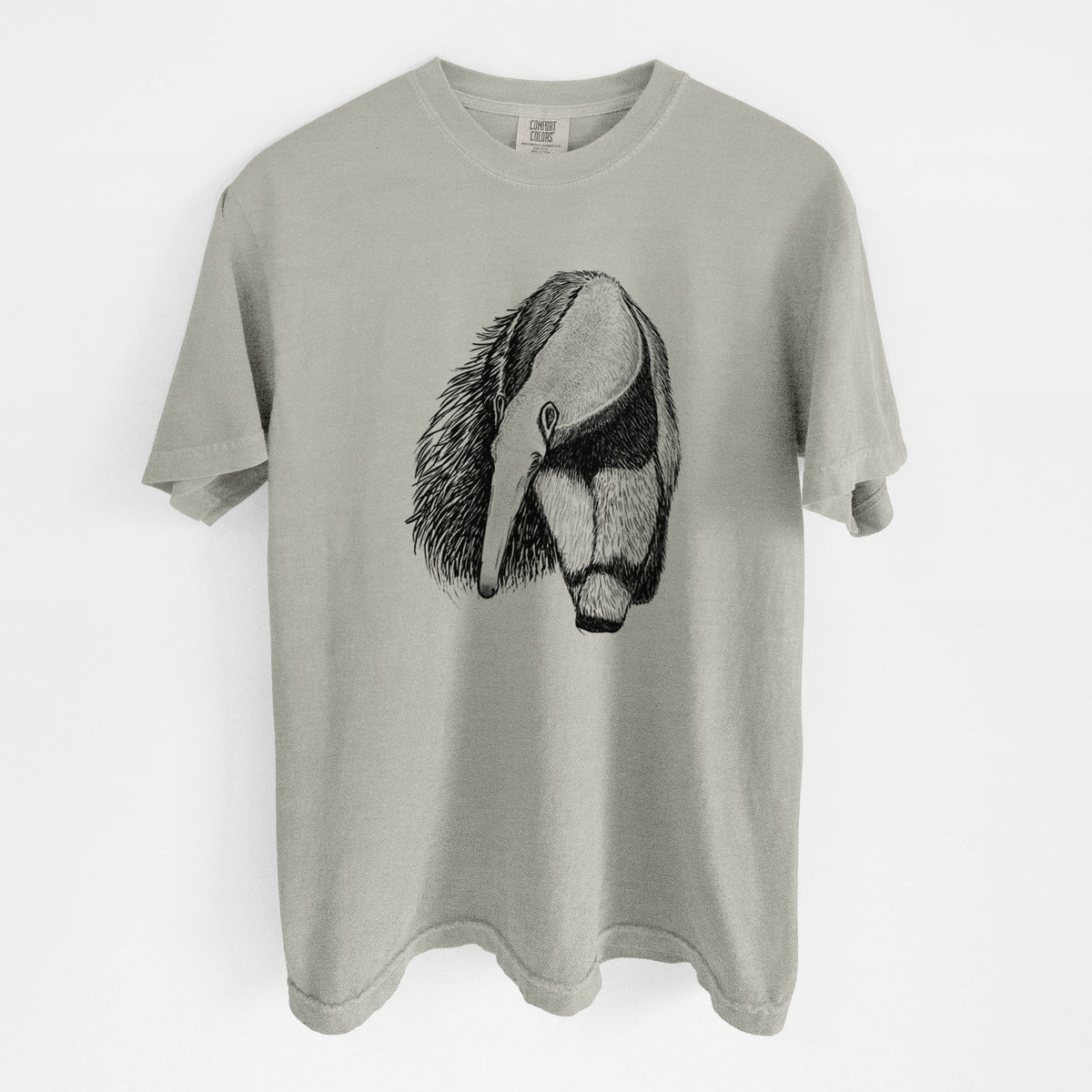 Sandstone beige Comfort Colors t-shirt laid flat, printed with a detailed black ink illustration of a giant anteater with its long snout and bushy tail.