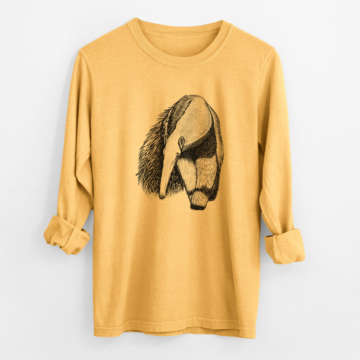 Golden wheat yellow Comfort Colors long sleeve shirt laid flat with the cuffs rolled, printed with a detailed black ink illustration of a giant anteater with its long snout and bushy tail.