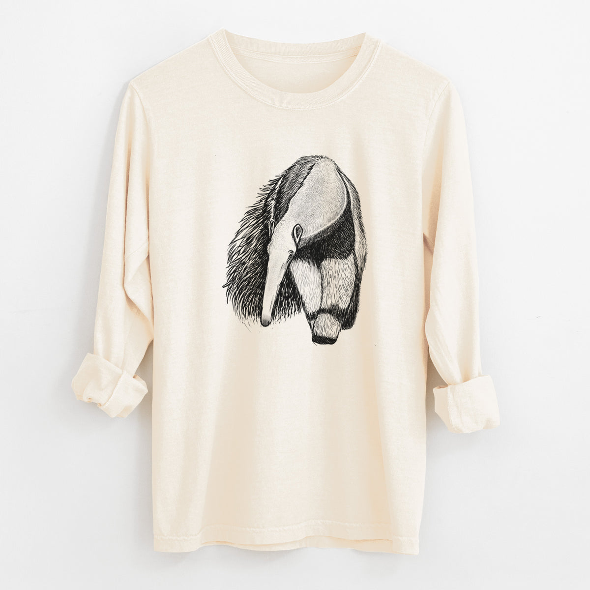 Ivory Comfort Colors long sleeve shirt laid flat with the cuffs rolled, printed with a detailed black ink illustration of a giant anteater with its long snout and bushy tail.