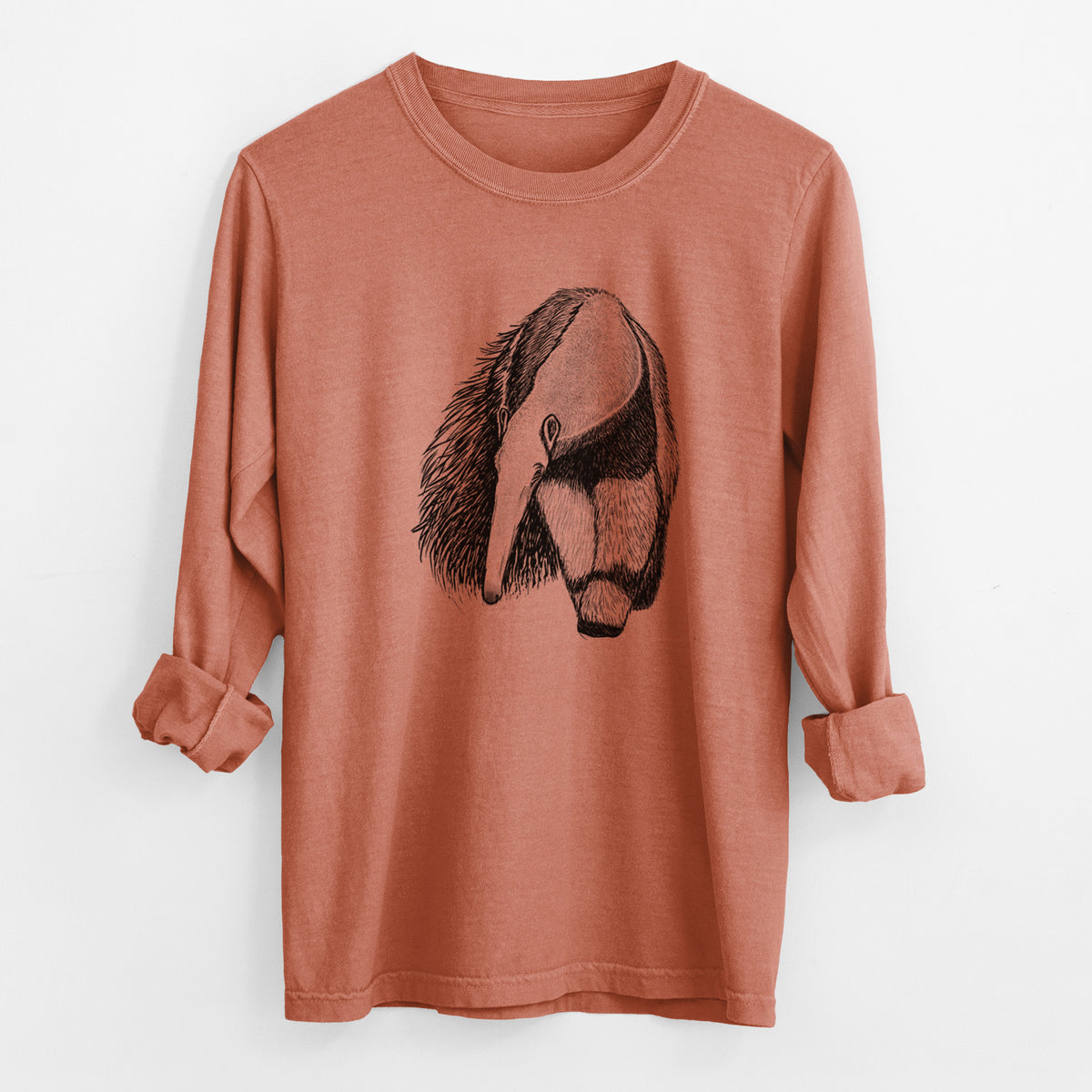 Yam burnt orange Comfort Colors long sleeve shirt laid flat with the cuffs rolled, printed with a detailed black ink illustration of a giant anteater with its long snout and bushy tail.