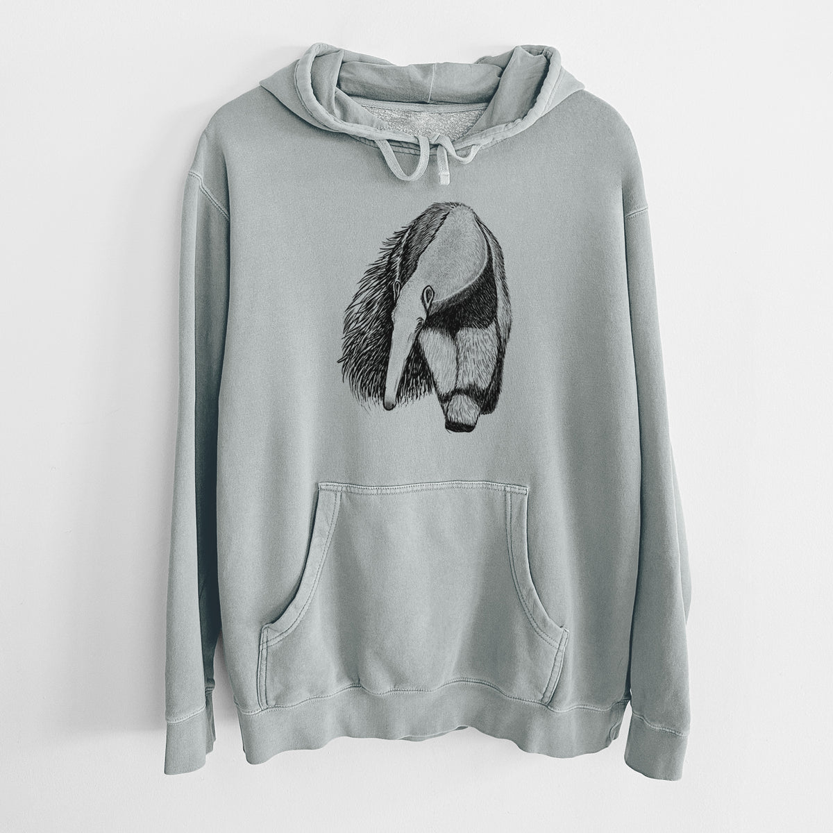 Sage green pigment dyed hoodie laid flat, printed with a detailed black ink illustration of a giant anteater with its long snout and bushy tail.