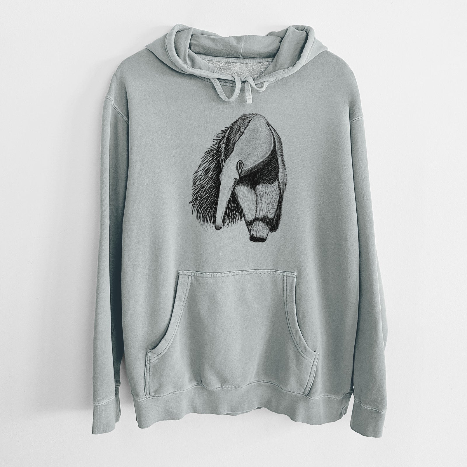 Sage green pigment dyed hoodie laid flat, printed with a detailed black ink illustration of a giant anteater with its long snout and bushy tail.