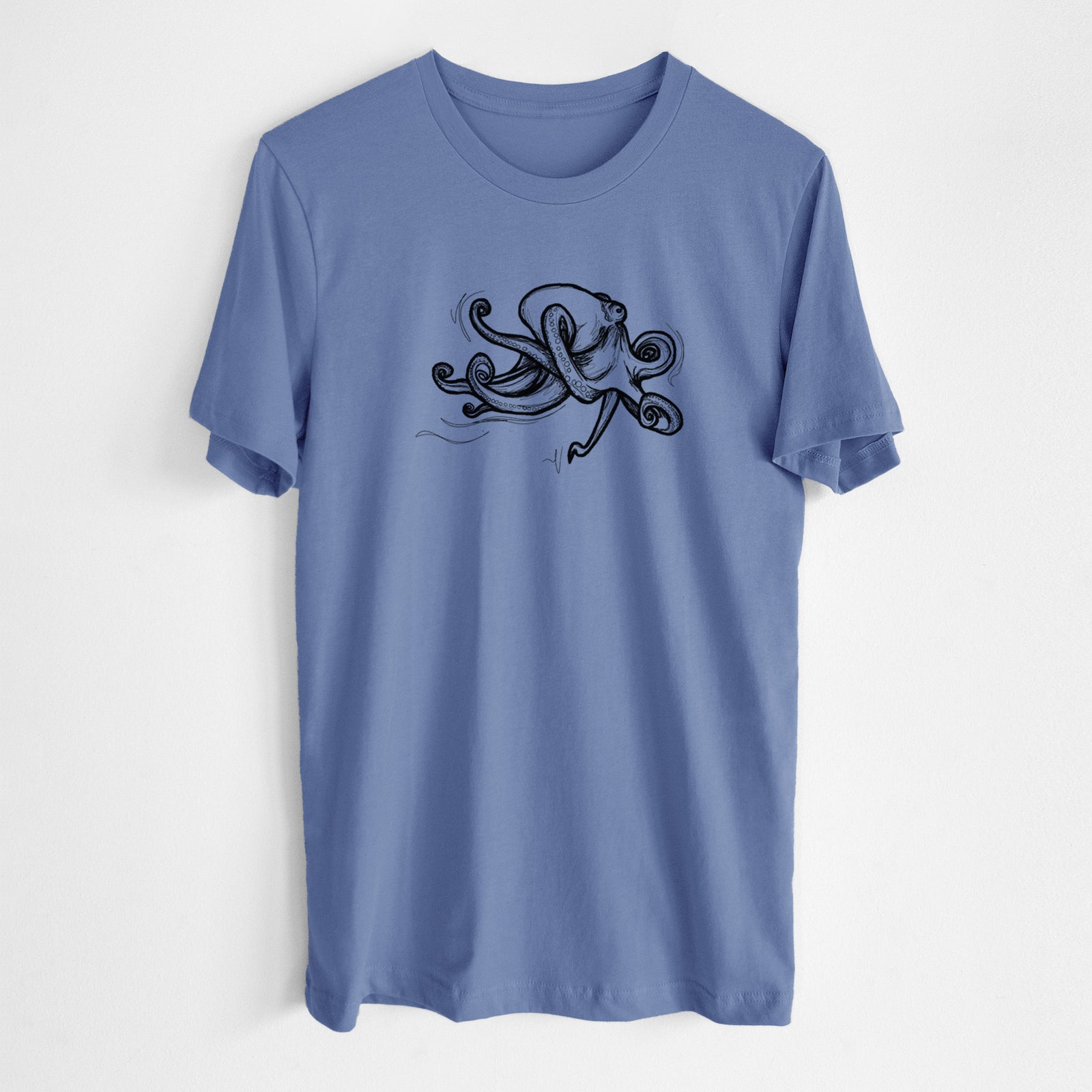 Blue bell lightweight cotton t-shirt laid flat, printed with a black ink illustration of a giant Pacific octopus with curling tentacles.