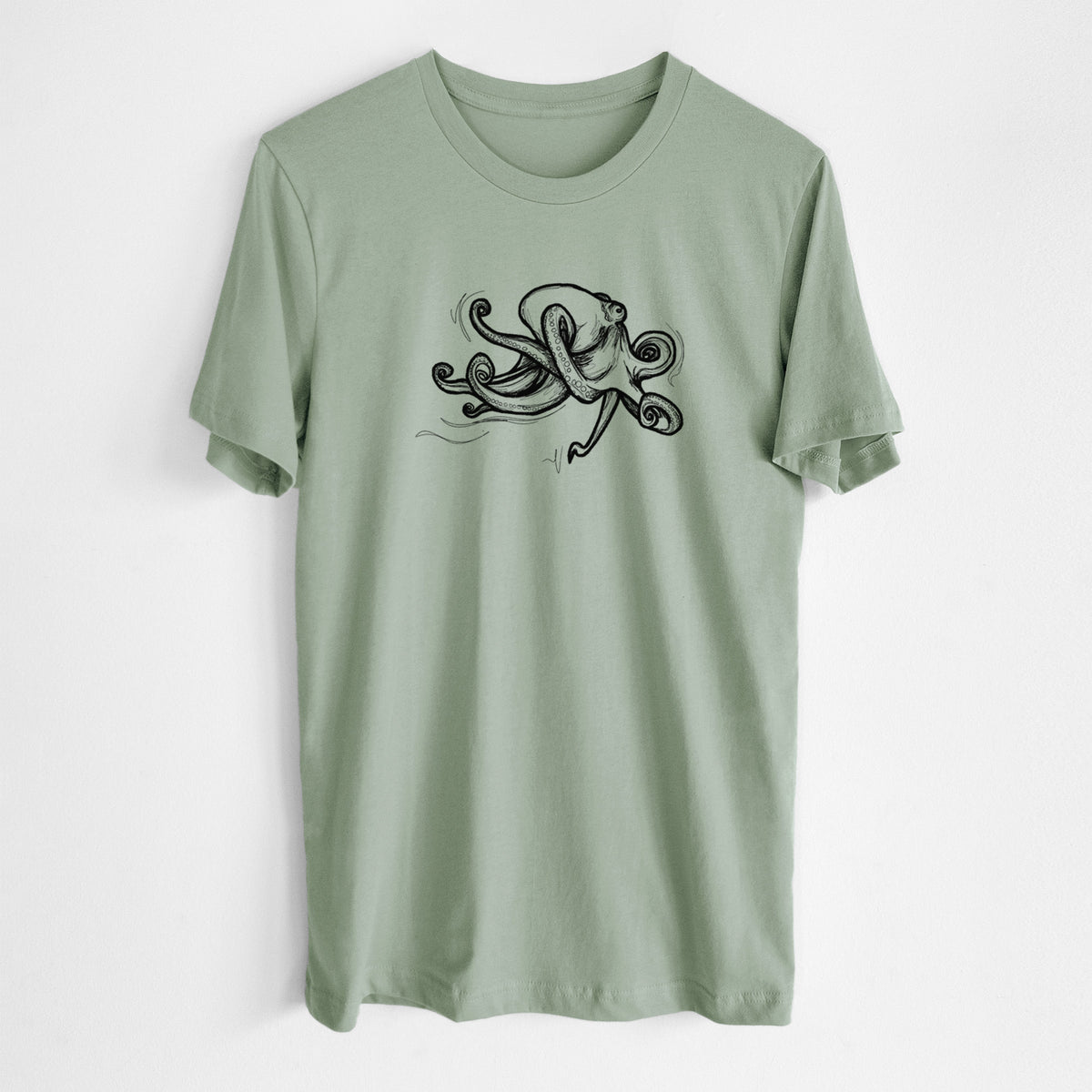 Sage green lightweight cotton t-shirt laid flat, printed with a black ink illustration of a giant Pacific octopus with curling tentacles.