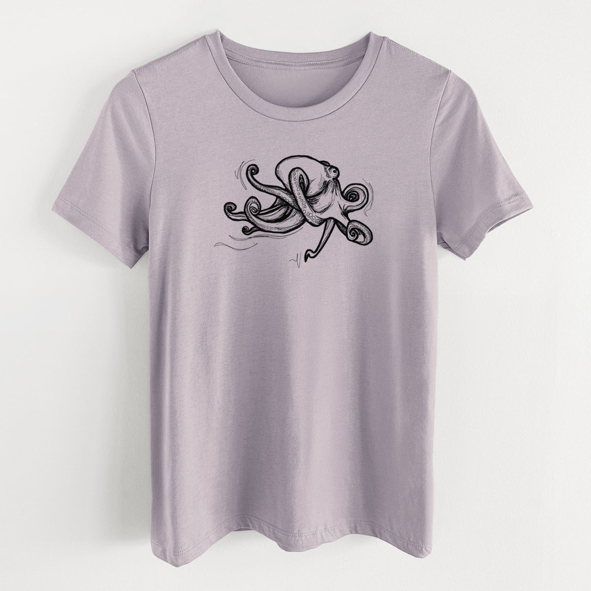 Light violet women's relaxed fit cotton t-shirt laid flat, printed with a black ink illustration of a giant Pacific octopus with curling tentacles.