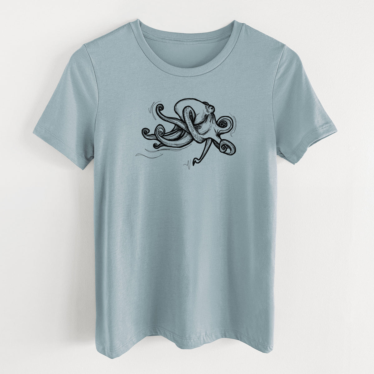 Vintage denim women's relaxed fit cotton t-shirt laid flat, printed with a black ink illustration of a giant Pacific octopus with curling tentacles.