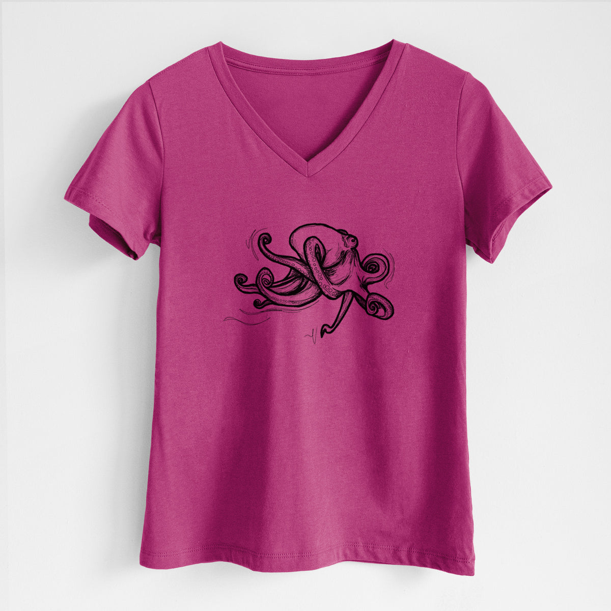 Berry pink women's relaxed fit cotton V-neck t-shirt laid flat, printed with a black ink illustration of a giant Pacific octopus with curling tentacles.