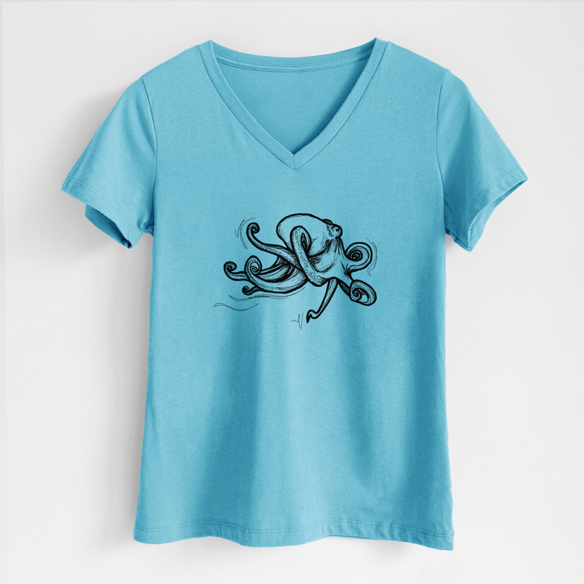 Turquoise women's relaxed fit cotton V-neck t-shirt laid flat, printed with a black ink illustration of a giant Pacific octopus with curling tentacles.