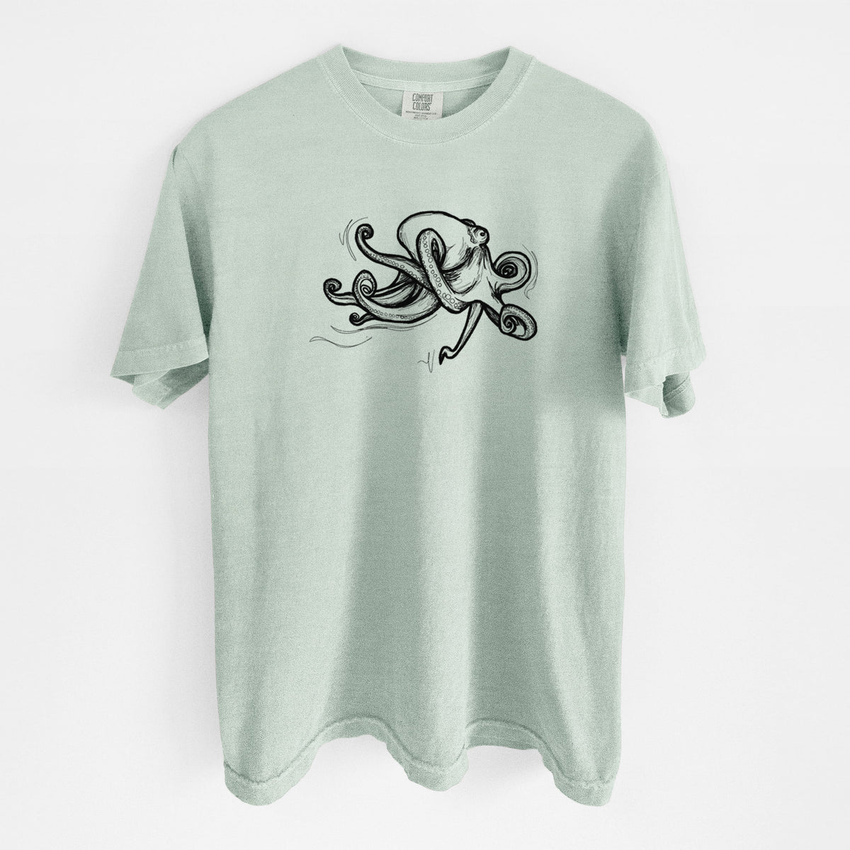 Bay green Comfort Colors t-shirt laid flat, printed with a black ink illustration of a giant Pacific octopus with curling tentacles.