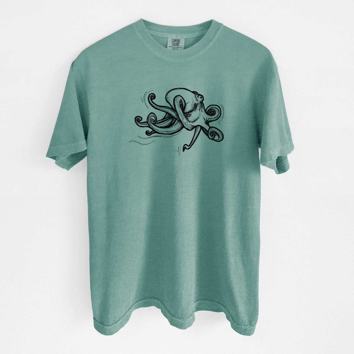 Reef green Comfort Colors t-shirt laid flat, printed with a black ink illustration of a giant Pacific octopus with curling tentacles.