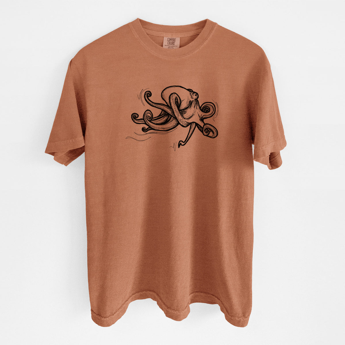 Yam burnt orange Comfort Colors t-shirt laid flat, printed with a black ink illustration of a giant Pacific octopus with curling tentacles.