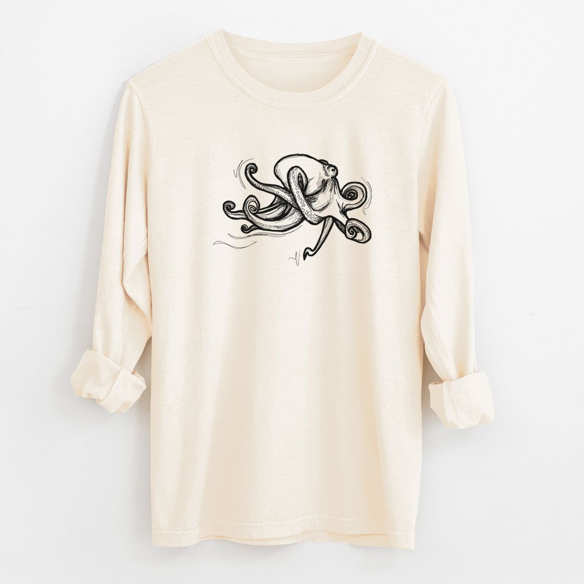 Ivory Comfort Colors long sleeve shirt laid flat with the cuffs rolled, printed with a black ink illustration of a giant Pacific octopus with curling tentacles.
