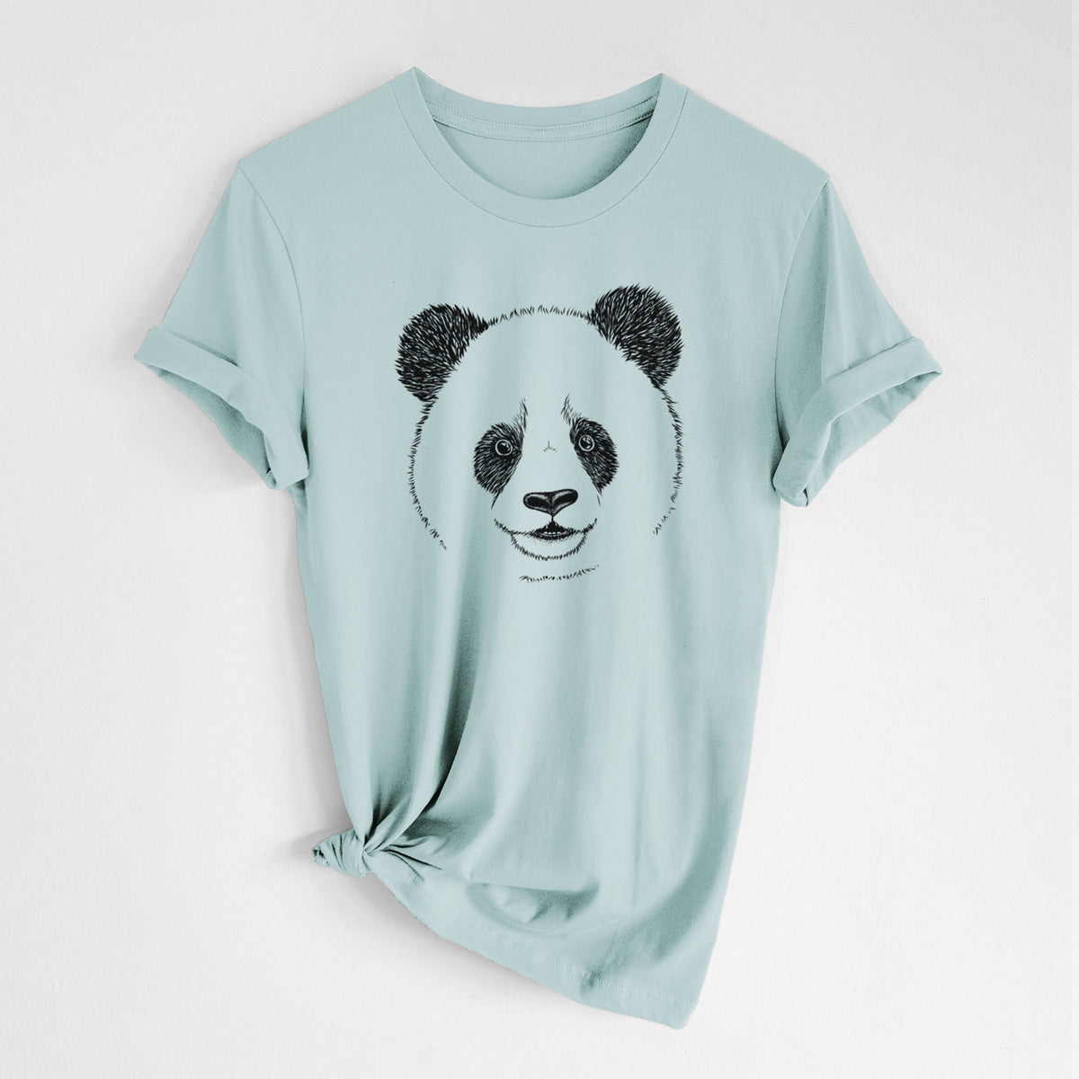 Dusty blue lightweight cotton t-shirt laid flat with the sleeves rolled, printed with a black ink portrait of a smiling giant panda's face.