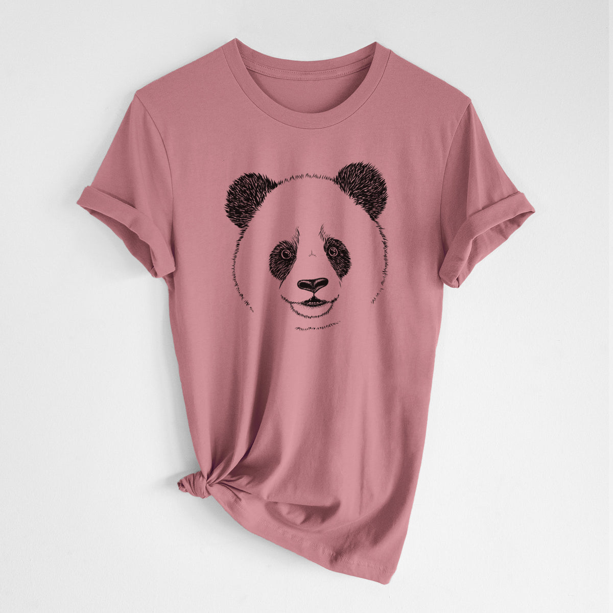 Mauve pink lightweight cotton t-shirt laid flat with the sleeves rolled, printed with a black ink portrait of a smiling giant panda's face.