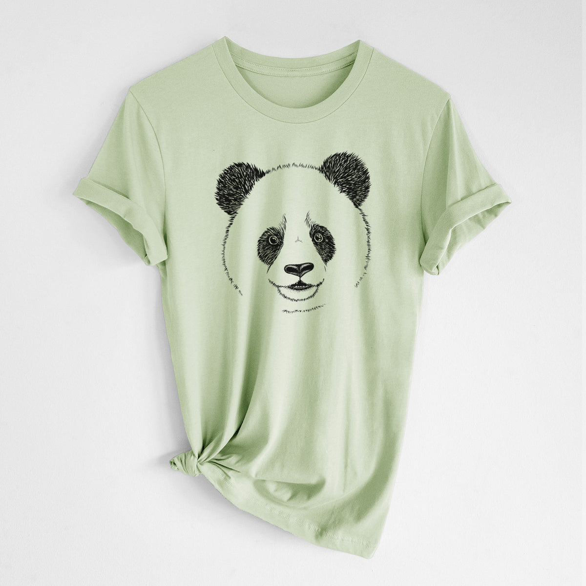 Spring green lightweight cotton t-shirt laid flat with the sleeves rolled, printed with a black ink portrait of a smiling giant panda's face.