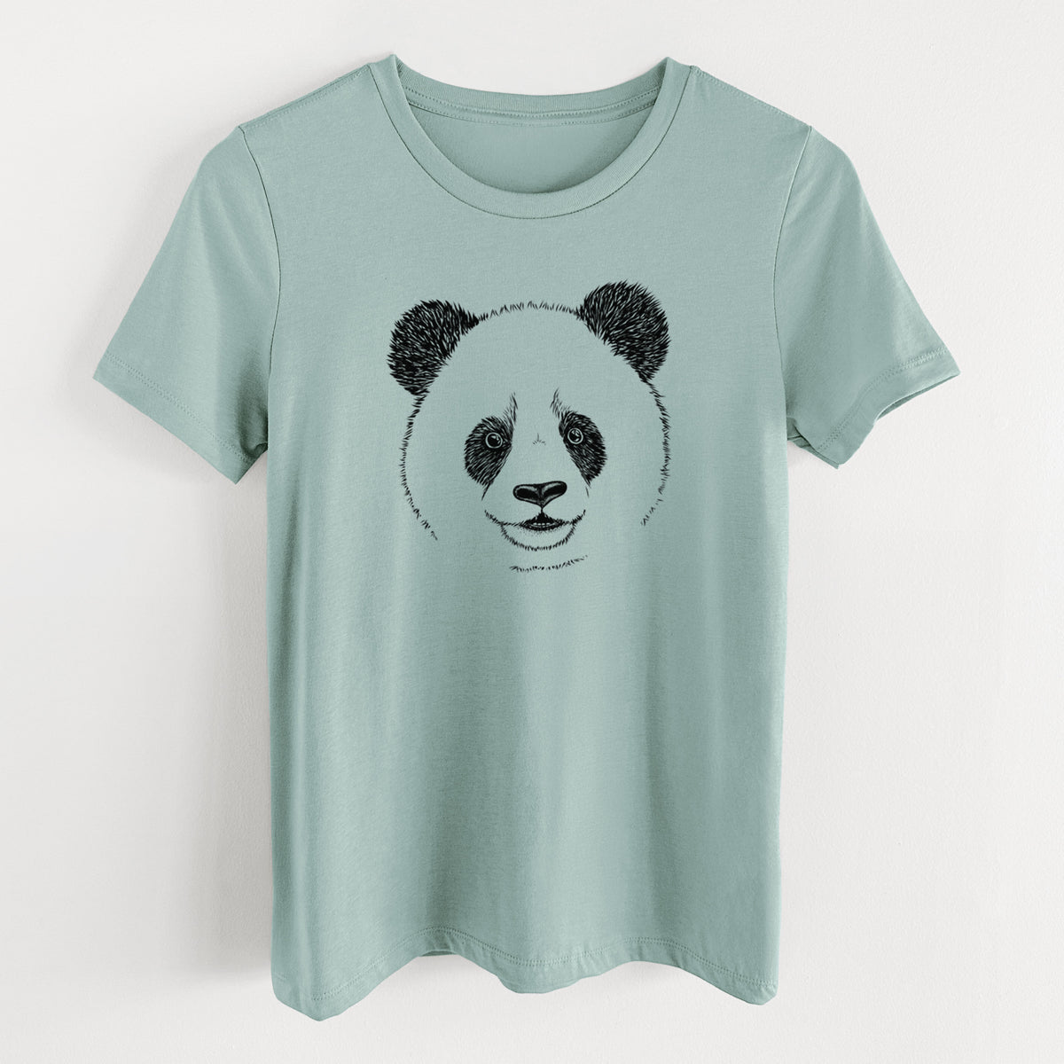 Dusty blue women's relaxed fit cotton t-shirt laid flat, printed with a black ink portrait of a smiling giant panda's face.