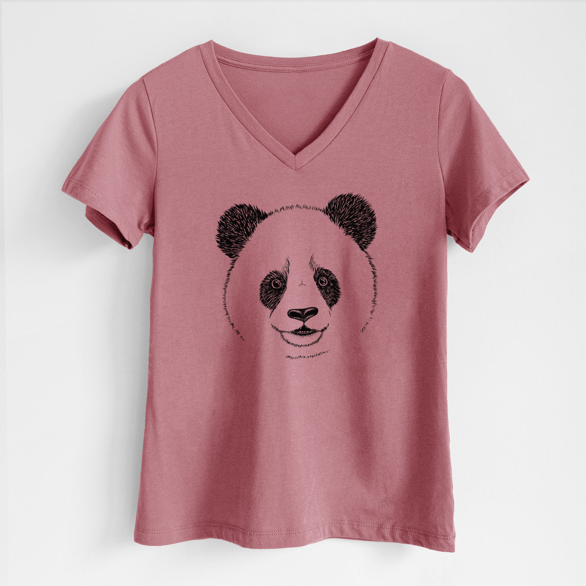 Mauve pink women's relaxed fit cotton V-neck t-shirt laid flat, printed with a black ink portrait of a smiling giant panda's face.