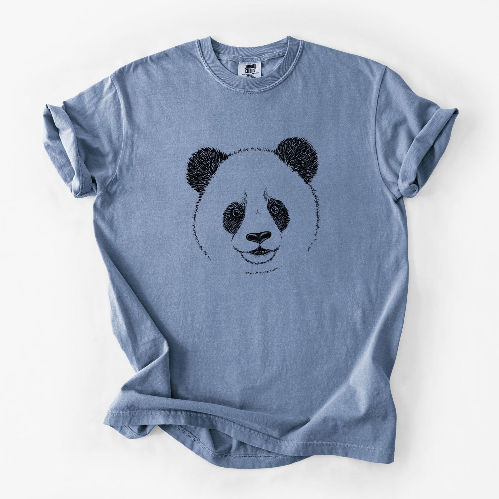 Blue jean Comfort Colors t-shirt laid flat, printed with a black ink portrait of a smiling giant panda's face.