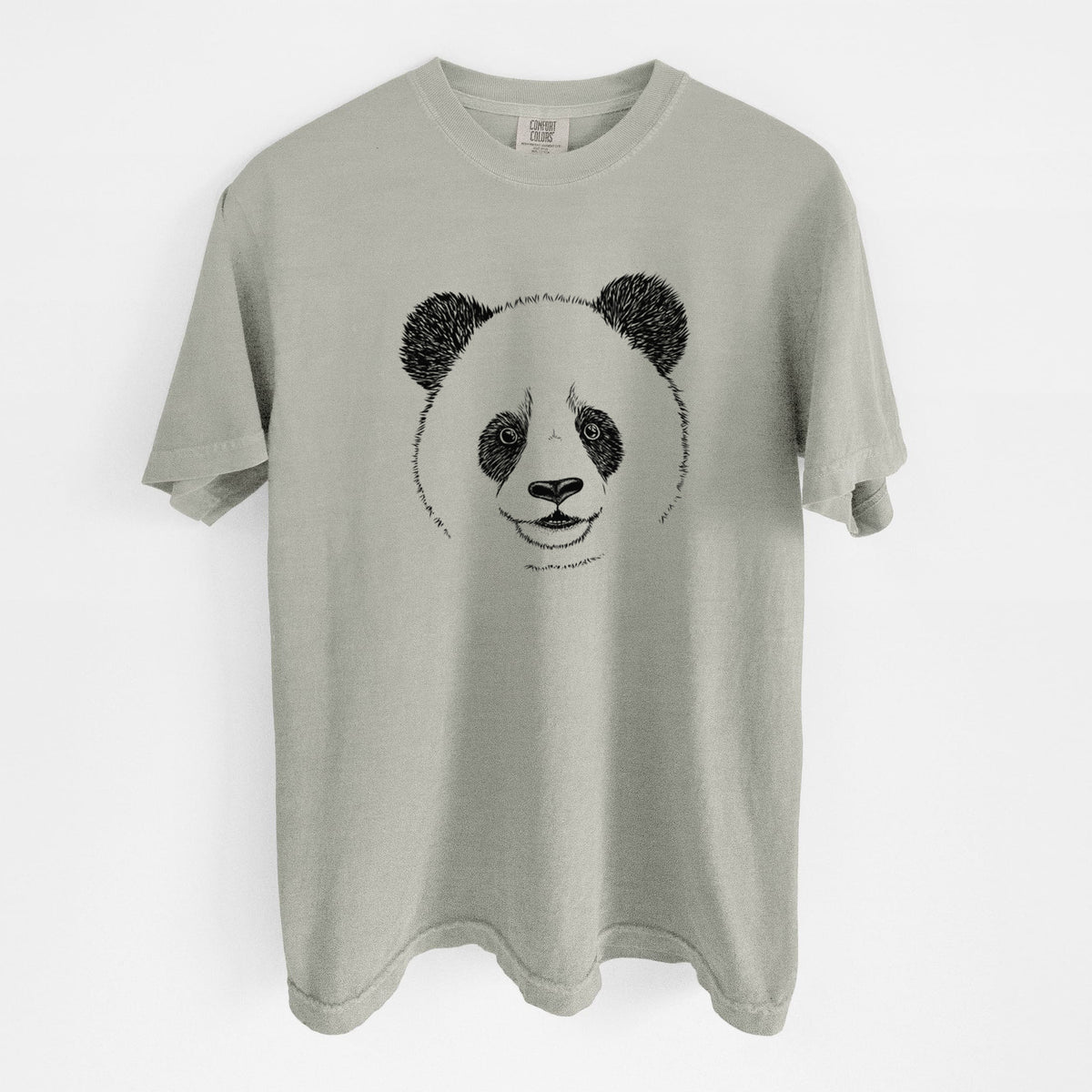 Sandstone beige Comfort Colors t-shirt laid flat, printed with a black ink portrait of a smiling giant panda's face.