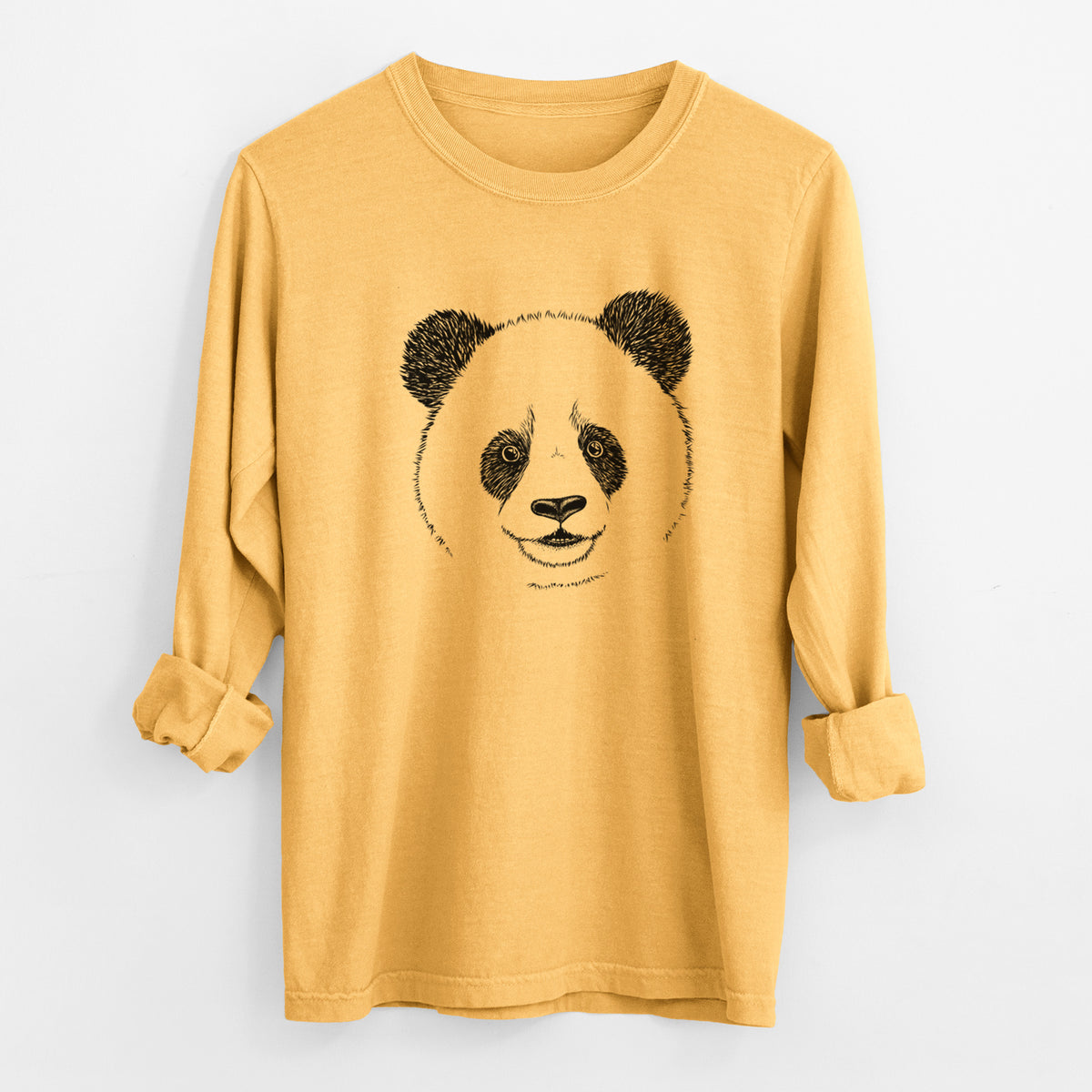 Golden wheat yellow Comfort Colors long sleeve shirt laid flat with the cuffs rolled, printed with a black ink portrait of a smiling giant panda's face.