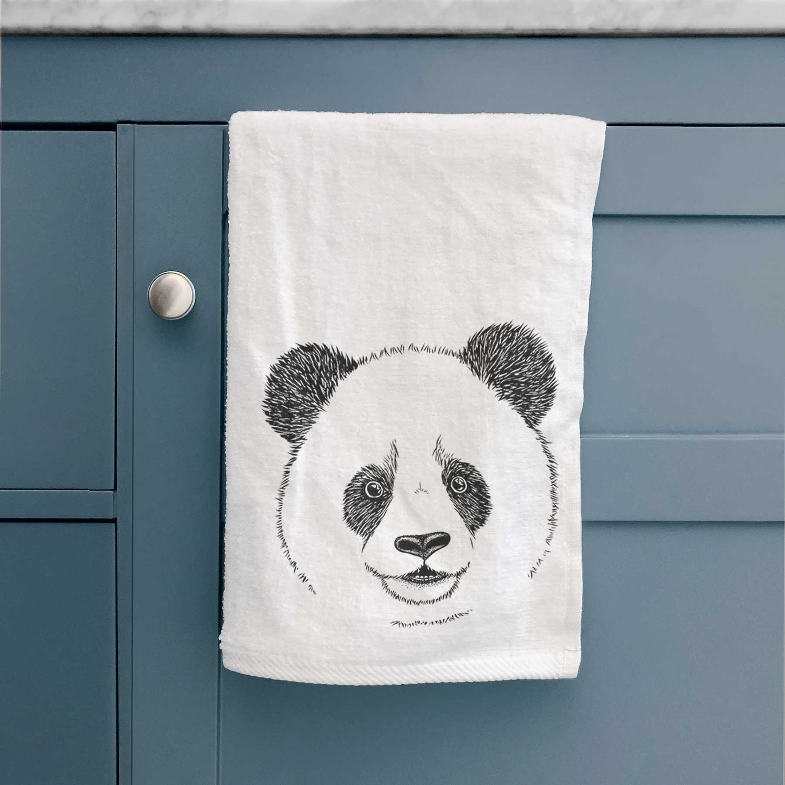 White hand towel printed with a black ink portrait of a smiling giant panda's face.