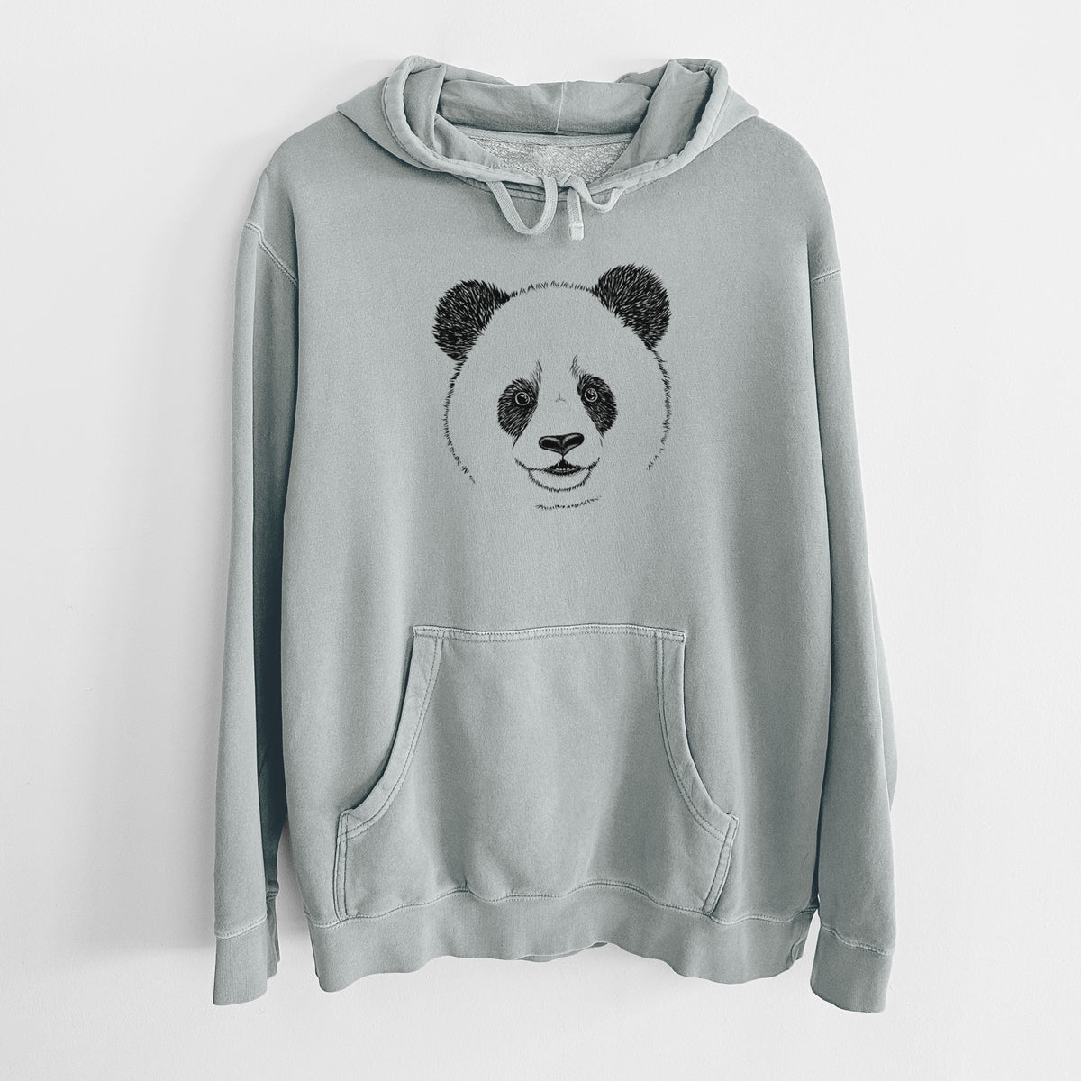 Sage green pigment dyed hoodie laid flat, printed with a black ink portrait of a smiling giant panda's face.