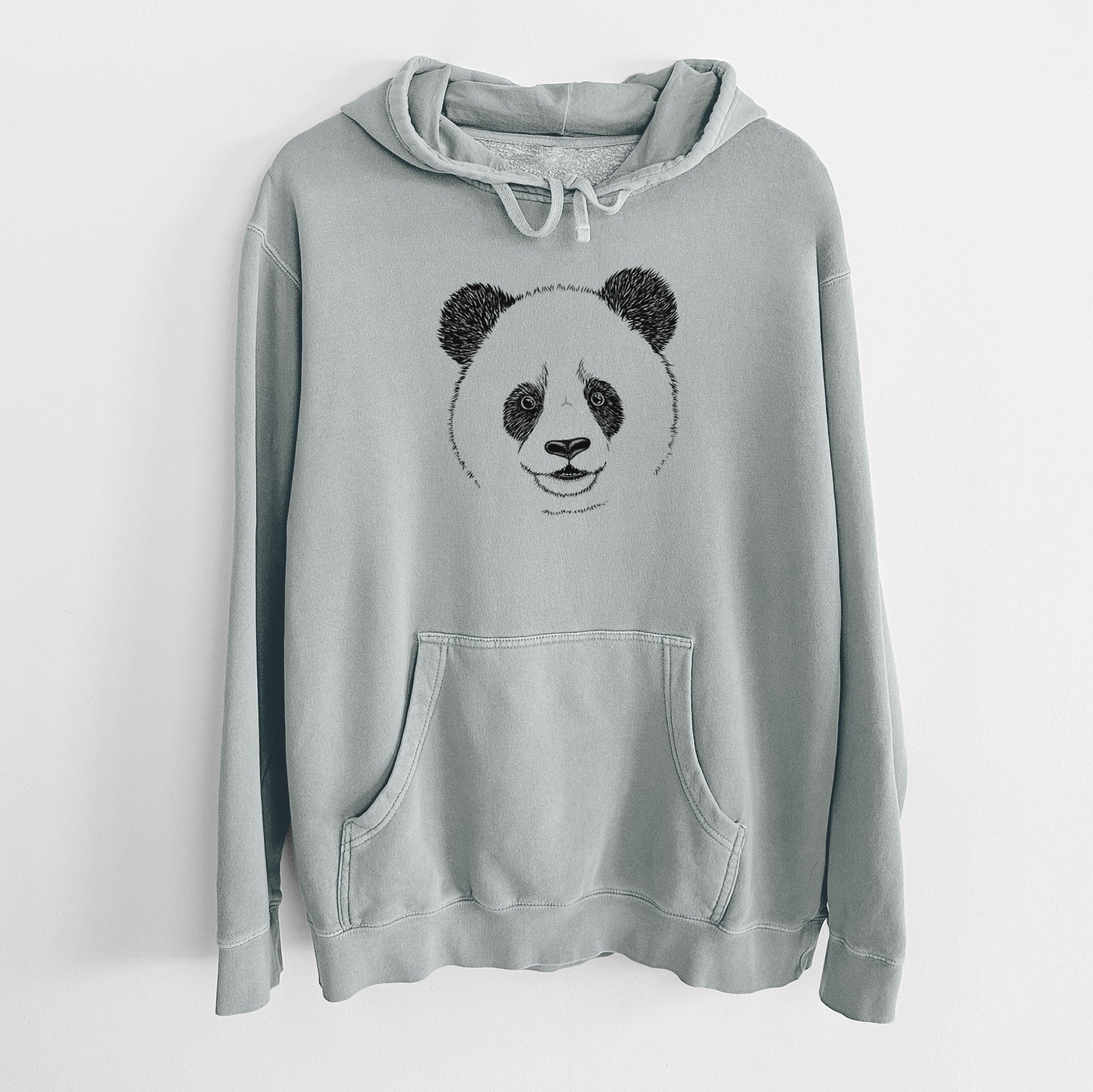 Sage green pigment dyed hoodie laid flat, printed with a black ink portrait of a smiling giant panda's face.
