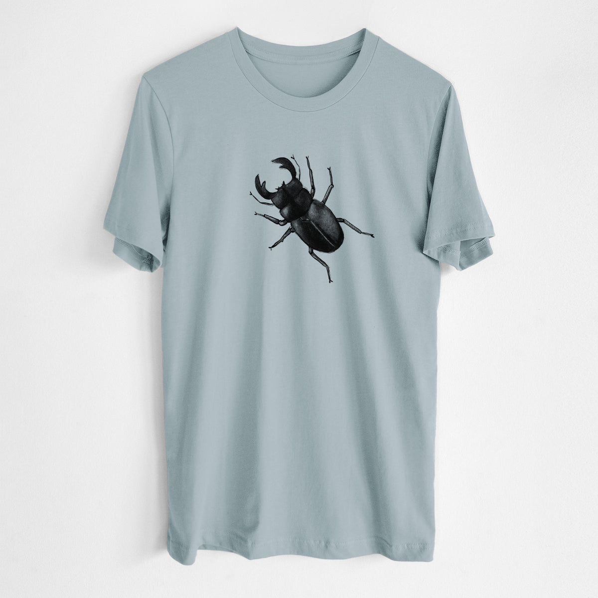Vintage denim lightweight cotton t-shirt laid flat, printed with a detailed black ink illustration of a giant stag beetle with large jaws, seen from above.