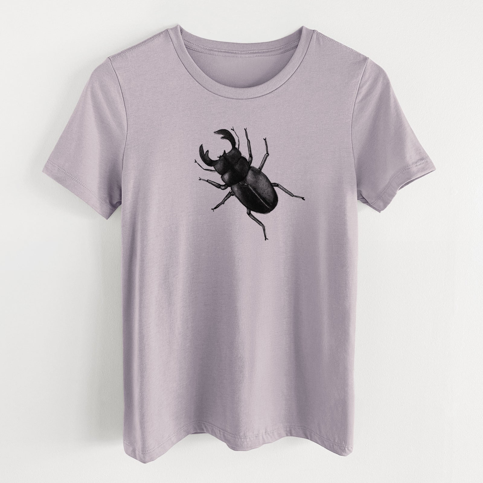 Light violet women's relaxed fit cotton t-shirt laid flat, printed with a detailed black ink illustration of a giant stag beetle with large jaws, seen from above.