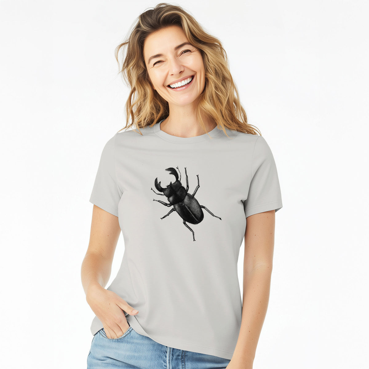Woman wearing a lunar grey women's relaxed fit cotton t-shirt printed with a detailed black ink illustration of a giant stag beetle with large jaws, seen from above.