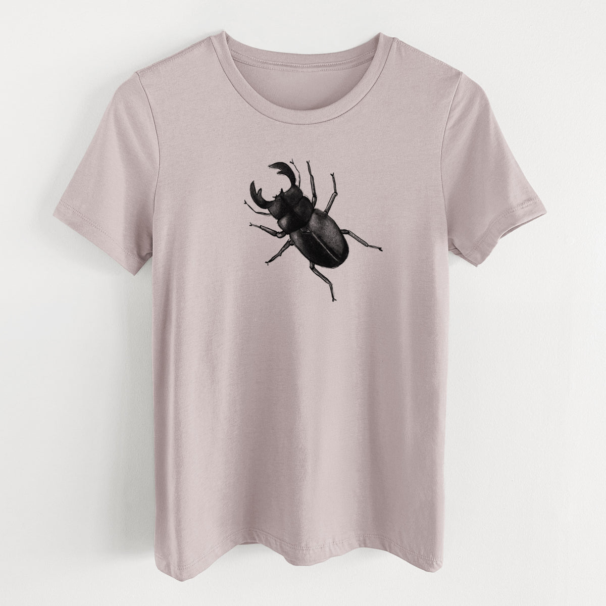 Pink gravel women's relaxed fit cotton t-shirt laid flat, printed with a detailed black ink illustration of a giant stag beetle with large jaws, seen from above.