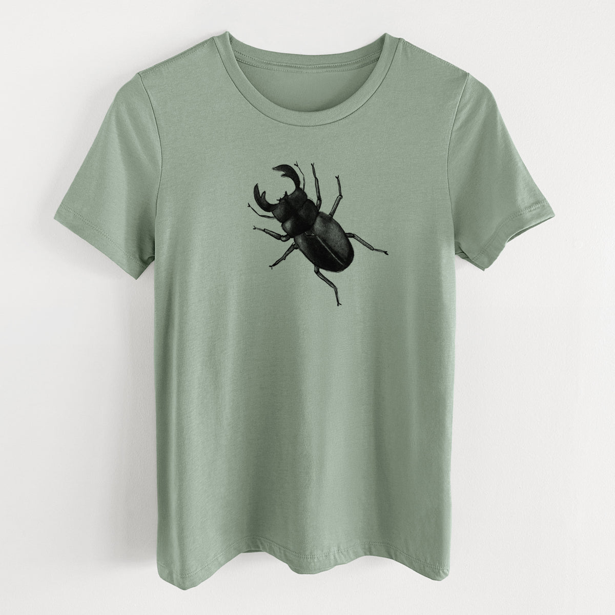 Sage green women's relaxed fit cotton t-shirt laid flat, printed with a detailed black ink illustration of a giant stag beetle with large jaws, seen from above.