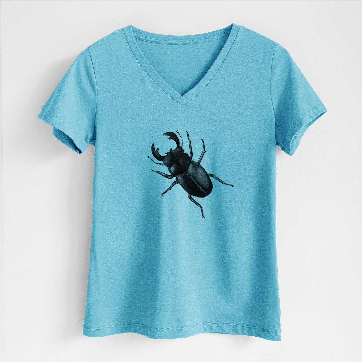 Turquoise women's relaxed fit cotton V-neck t-shirt laid flat, printed with a detailed black ink illustration of a giant stag beetle with large jaws, seen from above.
