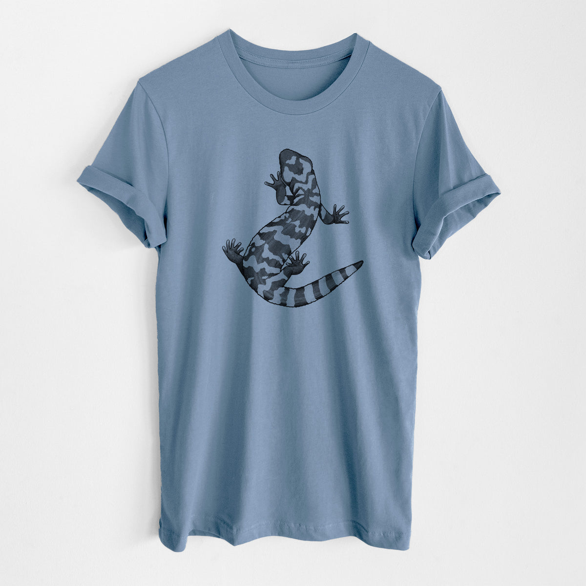 Steel blue lightweight cotton t-shirt laid flat, printed with a black ink illustration of a Gila monster with bold patterned skin.