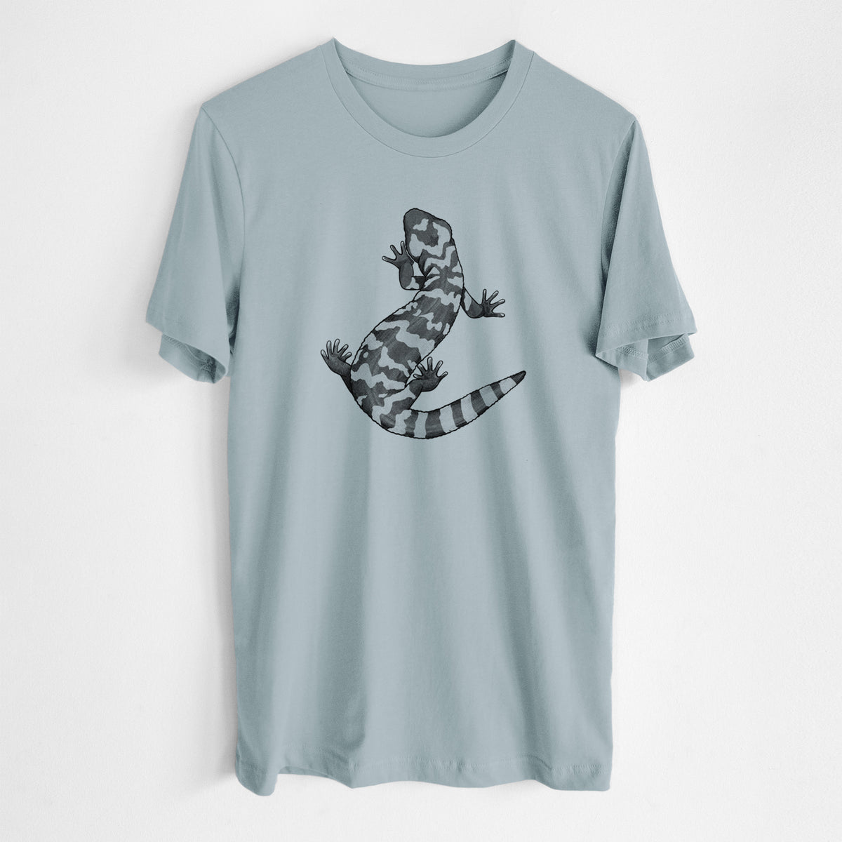 Vintage denim lightweight cotton t-shirt laid flat, printed with a black ink illustration of a Gila monster with bold patterned skin.