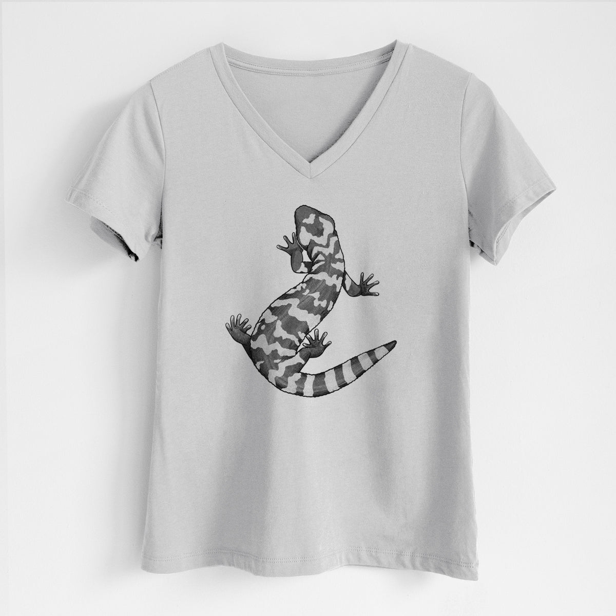 Lunar grey women's relaxed fit cotton V-neck t-shirt laid flat, printed with a black ink illustration of a Gila monster with bold patterned skin.