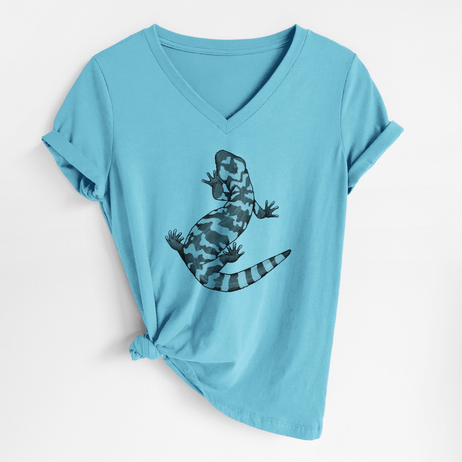 Turquoise women's relaxed fit cotton V-neck t-shirt laid flat, printed with a black ink illustration of a Gila monster with bold patterned skin.