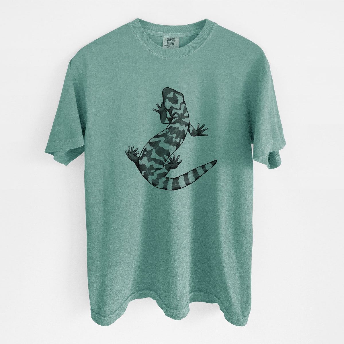 Reef green Comfort Colors t-shirt laid flat, printed with a black ink illustration of a Gila monster with bold patterned skin.
