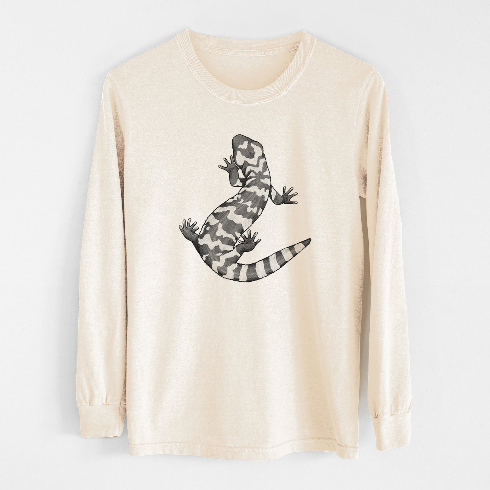 Ivory Comfort Colors long sleeve shirt laid flat, printed with a black ink illustration of a Gila monster with bold patterned skin.