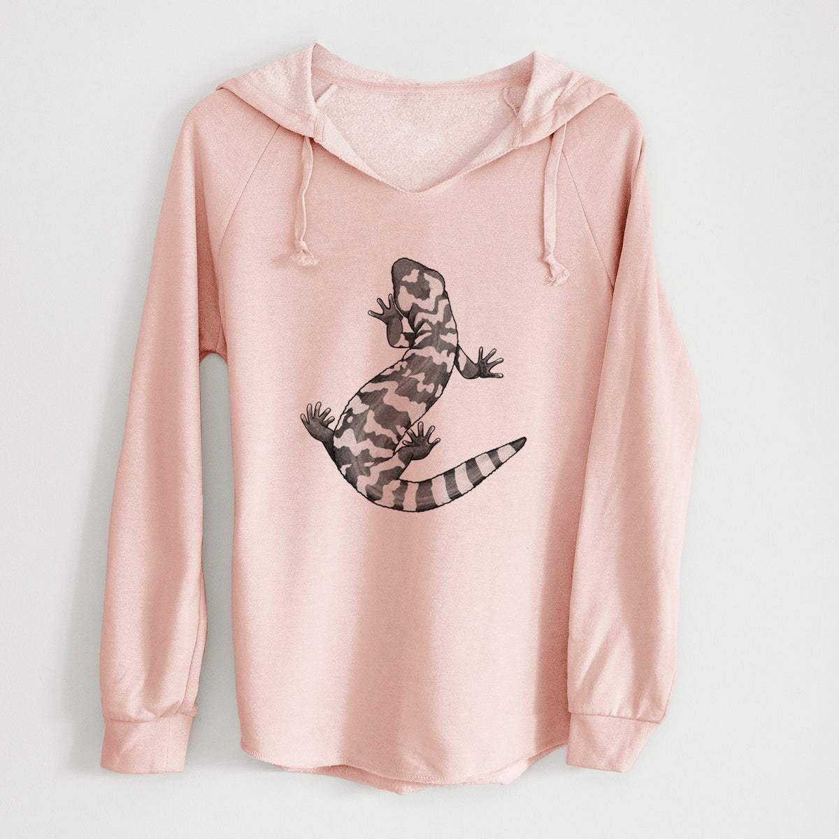 Blush pink women's Cali Wave hooded sweatshirt laid flat, printed with a black ink illustration of a Gila monster with bold patterned skin.
