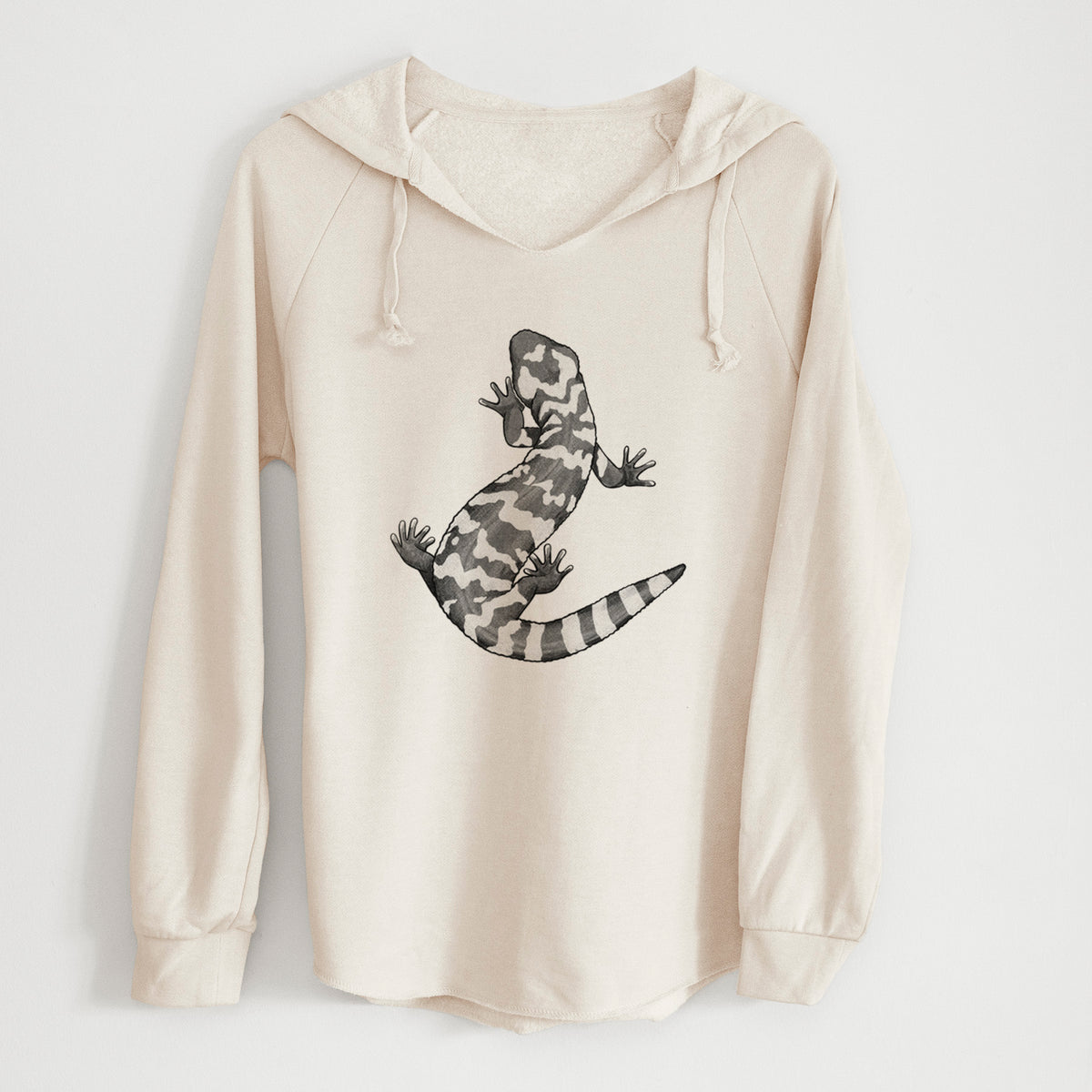 Bone cream women's Cali Wave hooded sweatshirt laid flat, printed with a black ink illustration of a Gila monster with bold patterned skin.