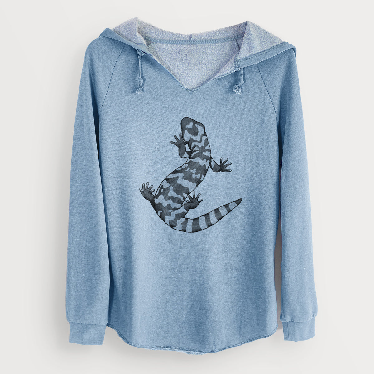 Misty blue women's Cali Wave hooded sweatshirt laid flat, printed with a black ink illustration of a Gila monster with bold patterned skin.