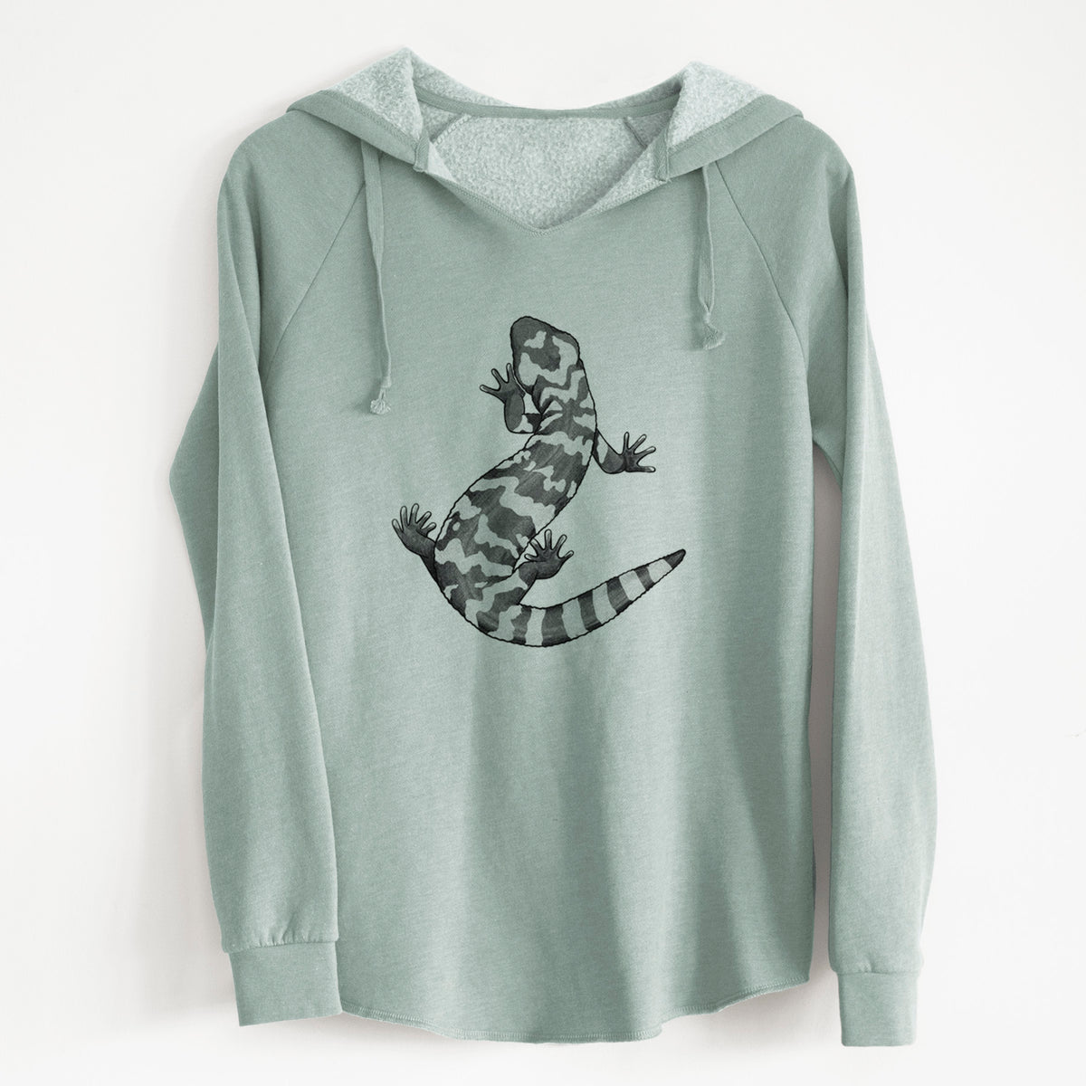 Sage green women's Cali Wave hooded sweatshirt laid flat, printed with a black ink illustration of a Gila monster with bold patterned skin.