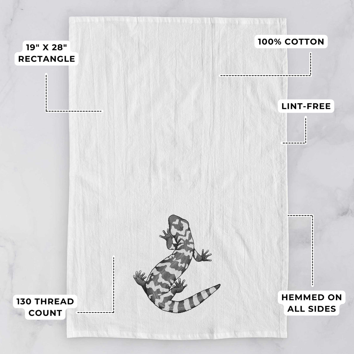 White tea towel printed with a black ink illustration of a Gila monster with bold patterned skin, with feature labels: 19 by 28 inch rectangle, 100% cotton, lint-free, 130 thread count, hemmed on all sides.